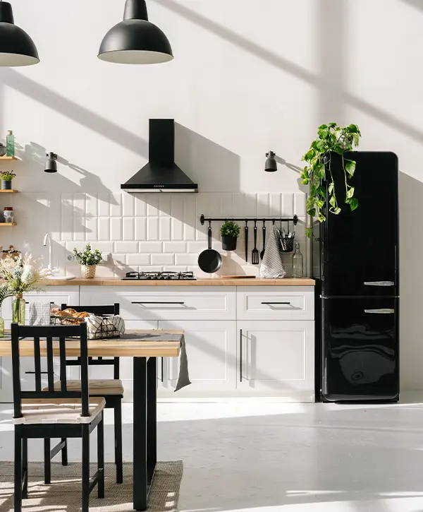 A beautiful upscale kitchen with black appliances