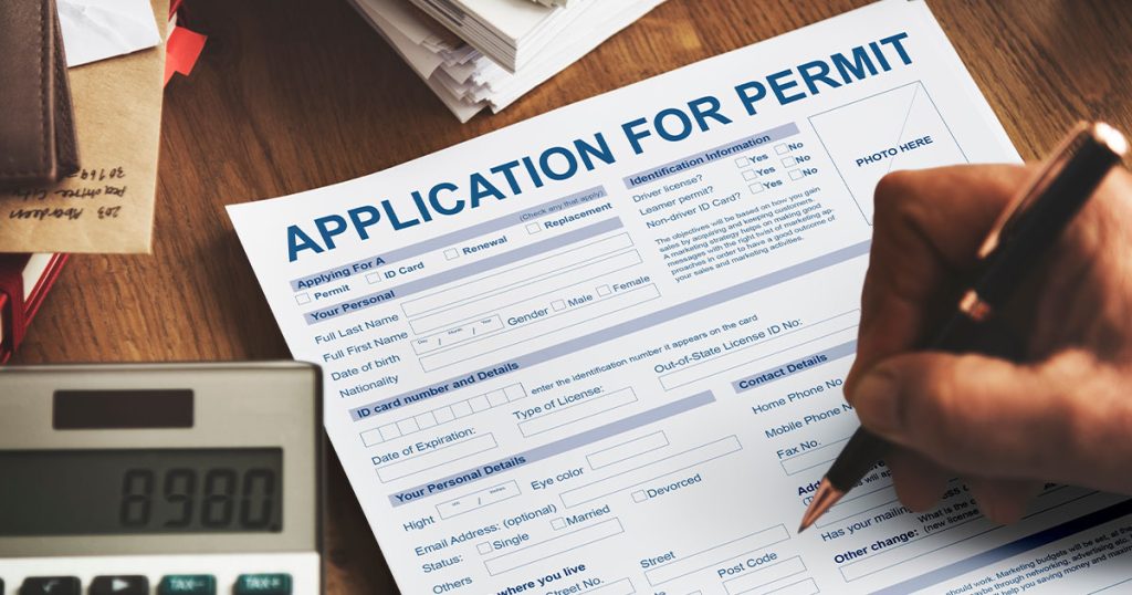 A paper that reads "application for permit"