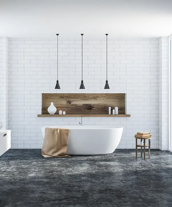 Upscale bathroom with a freestanding tub and black pendant lights