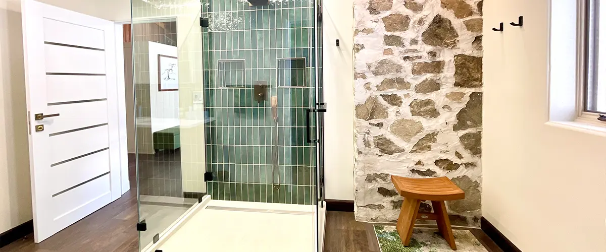 A bathroom remodel cost with a tiled glass shower and a masonry wall