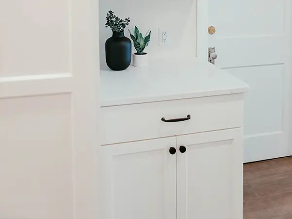 White kitchen cabinets with black hardware