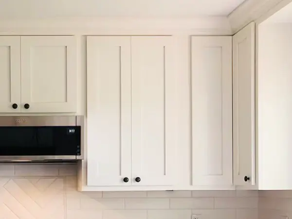 White cabinets with dark knobs