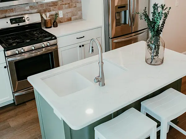 An undermount sink on a white countertop