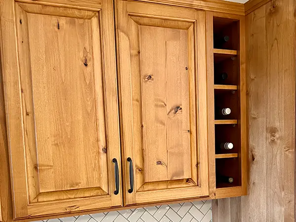 Wood cabinet with small shelves for wine bottles