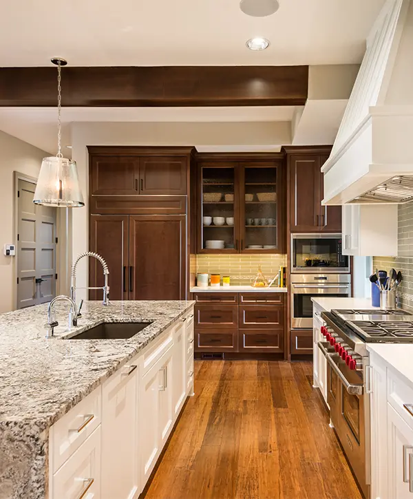 Hardwood floors with wood cabinets in a kitchen remodeling in Wausau with granite tops