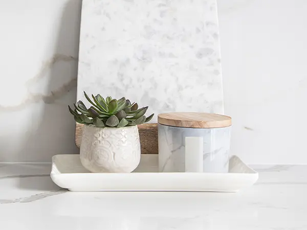 Quartz countertop with a quartz cutting board and potted plants