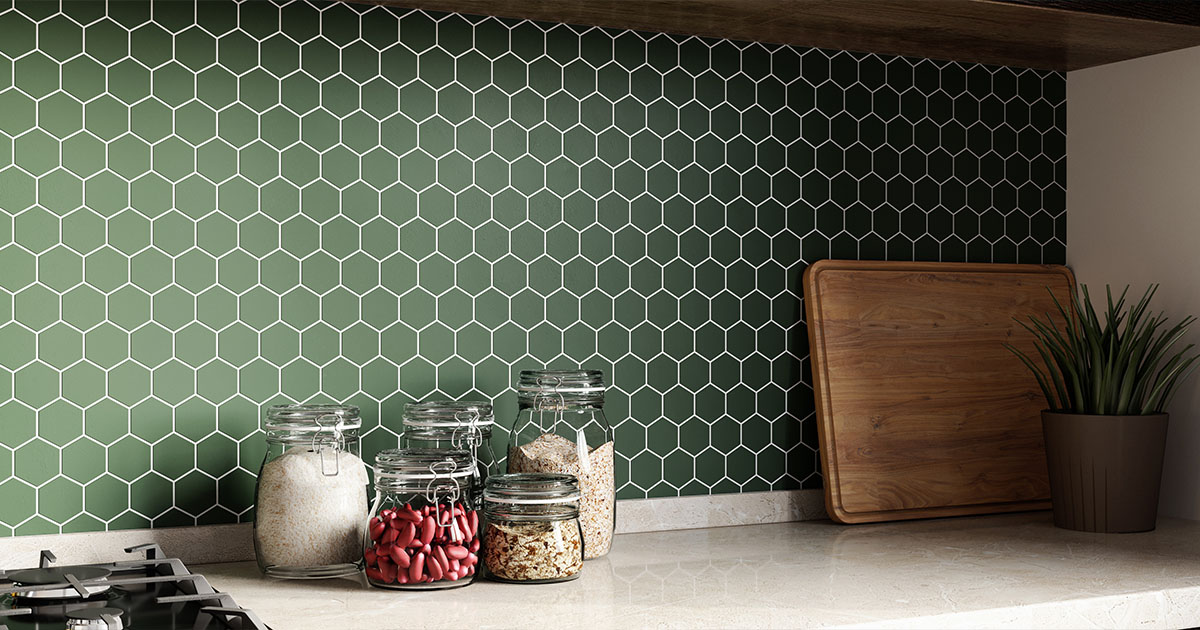 Mosaic green tile backsplash with white countertop bellow