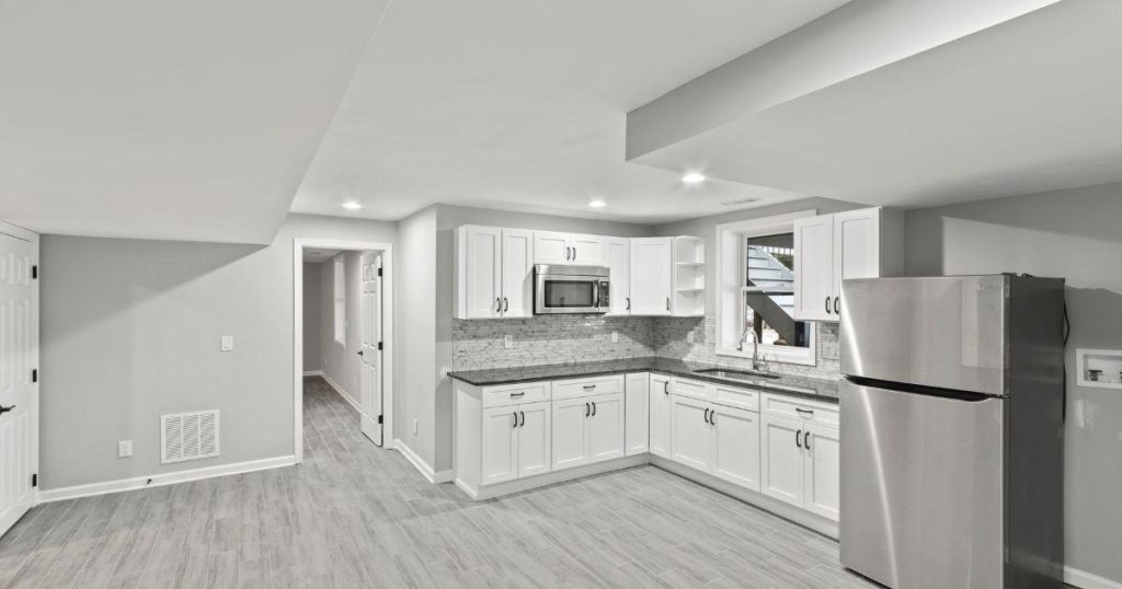 The same basement kitchen as the first image, shown from a slightly different angle.