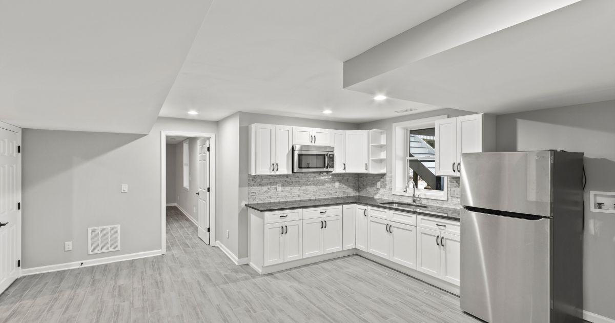 The same basement kitchen as the first image, shown from a slightly different angle.