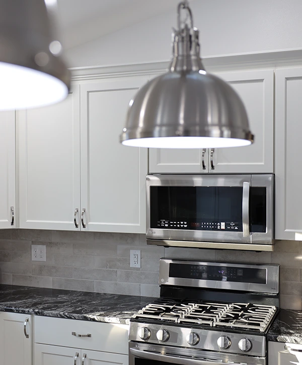 white kitchen design with island and bar stools